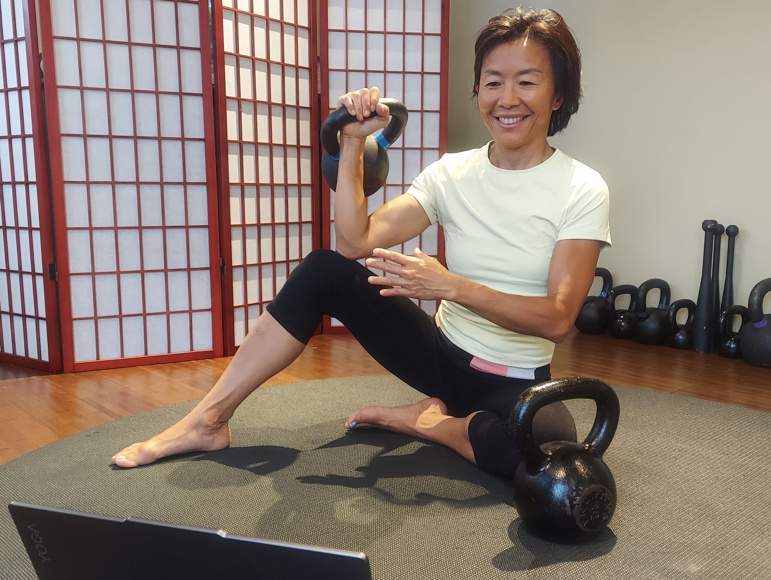 A woman coaching someone via video call